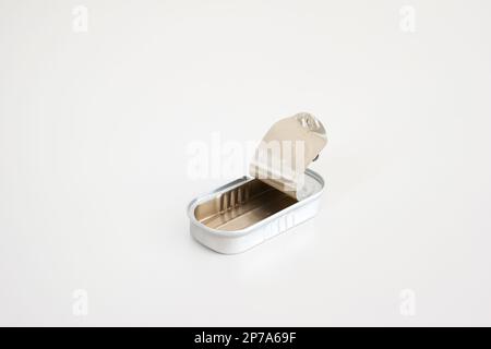 Opened empty fish tin can studio shot isolated on white top view. Stock Photo