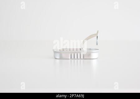 Opened empty fish tin can studio shot isolated on white front view. Stock Photo