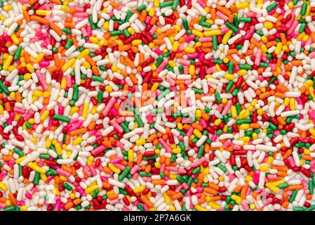 Top view of multicolor rainbow sprinkles. Colorful sprinkles sugar background. Sugar sprinkles is for decoration cake and other bakery items Stock Photo
