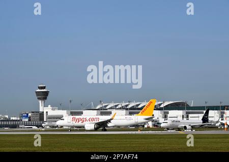 Pegasus Boeing B737 waiting for take-off clearance on runway south with tower, Munich Airport, Upper Bavaria, Bavaria, Germany Stock Photo