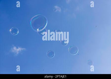 Soap bubbles against a blue sky, Stuttgart, Baden-Wuerttemberg Stock Photo