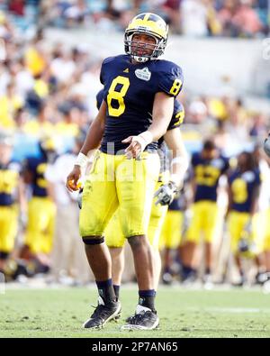 Michigan Linebacker (8) Jonas Mouton lines up for a play in the Gator Bowl  against Mississippi