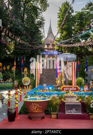 Buddhist offerings at the foot of stairs leading up to Wat Phnom in Phnom Penh, Cambodia. Stock Photo