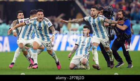 Argentina's Lionel Messi falls to his knees in celebration after Argentina's Gonzalo Montiel scores the winning penalty in the shoot out during the FIFA World Cup final at Lusail Stadium, Qatar. Picture date: Sunday December 18, 2022. Stock Photo