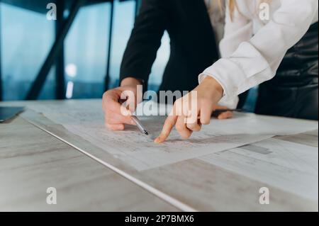 interior designers, architects are thinking about the project. teamwork on the house project Stock Photo
