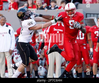 Nov. 13, 2010 - Raleigh, Carter-Finley Stadium, United States of America - NC  State quarterback Russell Wilson (#16) talks with linebacker Nate Irving  (#56) late in the game. NC State wins big