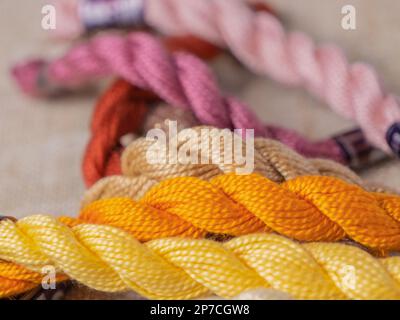 Multi-colored threads for embroidery, knitting, close-up, handmade threads, thread tows Stock Photo