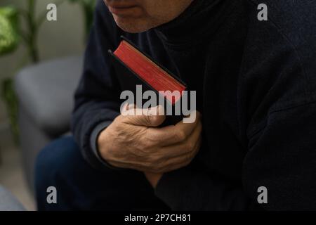Hands of man praying to god with the bible, Concept of faith for god Stock Photo