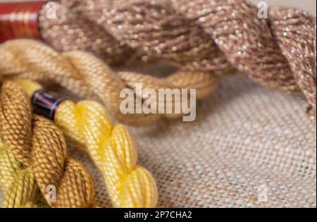 Multi-colored threads for embroidery, knitting, handmade threads, thread plaits, copy space Stock Photo