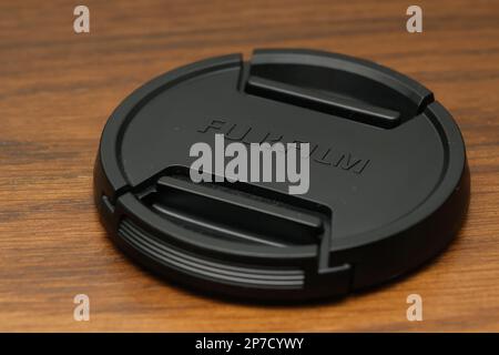 Hong Kong - 8 Mar 2023: Close up of Fujifilm mirrorless camera len cap Stock Photo