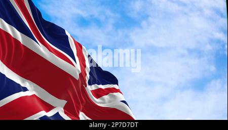 United Kingdom flag waving in the wind on a clear day. Union Jack. Blue field with red, white crosses of patron saints. Rippled fabric. 3d illustratio Stock Photo