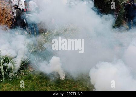 France / Paris / 07/03/2023, Jan Schmidt-Whitley/Le Pictorium -  Demonstration against pension reform in Paris  -  7/3/2023  -  France / Paris / Paris  -  A policeman tramples a CGT flag. Even if the number of strikers did not reach January's records, the unions hailed a 'historic mobilisation' on Tuesday 7 March, during demonstrations that brought together 1.28 million people in France, according to the Ministry of the Interior, and 3.5 million, according to the CGT. Stock Photo