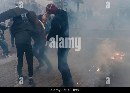 France / Paris / 07/03/2023, Jan Schmidt-Whitley/Le Pictorium -  Demonstration against pension reform in Paris  -  7/3/2023  -  France / Paris / Paris  -  Demonstrators are sprayed with tear gas. Even if the number of strikers did not reach January's records, the unions hailed a 'historic mobilisation' on Tuesday 7 March, during demonstrations that brought together 1.28 million people in France, according to the Ministry of the Interior, and 3.5 million, according to the CGT. Stock Photo