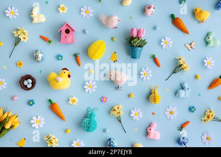 Background collection of Easter objects arranged on a blue background, overhead view Stock Photo