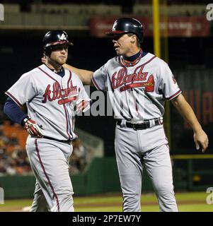 Atlanta Braves' David Justice, left, Damon Berryhill, center, and Terry  Pendleton walk back to the dugout after Berryhill's third inning three-run  home run against Philadelphia Phillies pitcher Bobby Thigpen in Game 2