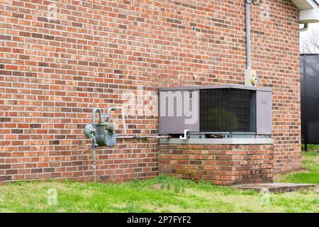 Horizontal shot of a commercial air conditioner outside of a small business. Stock Photo