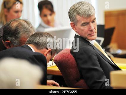 Members of the prosecution team in the murder trial of Mark Unger await ...