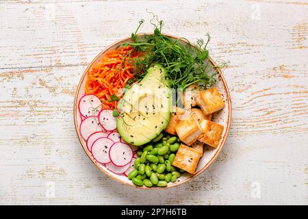 Buddha bowl asian salad with tofu cheese. Healthy vegan food, clean eating, dieting. Stock Photo