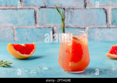 Cold lemonade/cocktail of fresh grapefruit juice, alcohol and ice cubes. Stock Photo