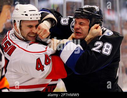 New Jersey Devils' Bryce Salvador, top, punches Tampa Bay Lightning's Zenon  Konopka (28) during a second-period fight an NHL hockey game Thursday, Oct.  8, 2009, in Tampa, Fla. (AP Photo/Chris O'Meara Stock