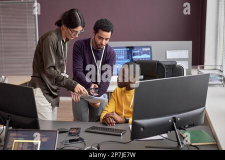 Group of business people collaborating on project in IT development office Stock Photo