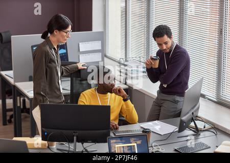 High angle view at group of business people working on project in IT development office Stock Photo
