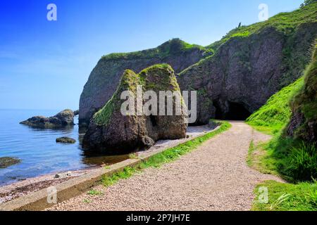 Cushendun caves along the Causeway Coast, Antrim, Northern Ireland Stock Photo