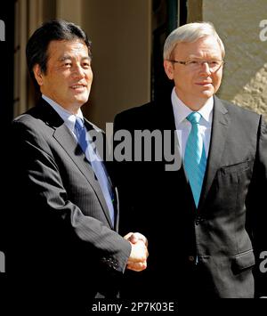 Japan's Foreign Minister Katsuya Okada, left, shakes hands with Australian Prime Minister Kevin Rudd in Sydney on Saturday, Feb. 20, 2010.(AP Photo/Greg Wood, Pool)