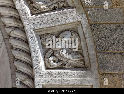 Detail, carved stone block from arched entry to Seaman’s Bank for Savings at 74 Wall Street in New York City’s Financial District. Stock Photo
