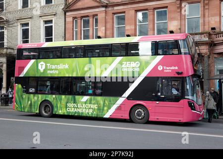 pink metro translink 100% electric belfast city bus public transport company Belfast Northern Ireland UK Stock Photo