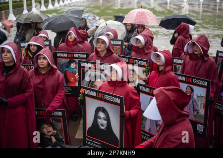 London/UK 08 FEB 2023 International Women day was marked by a silent march through Central London in Support of Iranian women. Ending at the Iranian Embassy where they removed and threw down their outer red garments. Aubrey Fagon/Alamy Live News Stock Photo