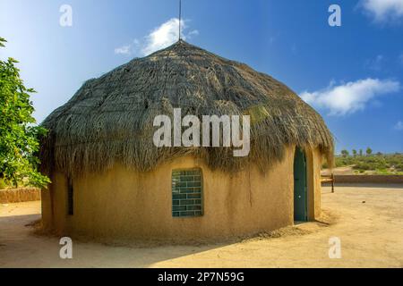 Traditional mud hut house in the Thar desert near the India Pakistan border Stock Photo