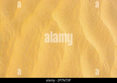 Rippled pattern of golden sand Stock Photo