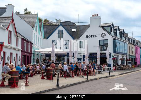 Baltimore, Ireland, June 12 2022: Tourist people sitting in the restaurants and coffee shops at Baltimore town Cork County Ireland Stock Photo