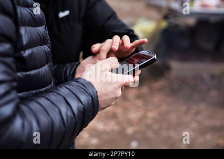 Male hands using mobile phone Stock Photo