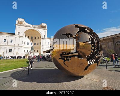 Sfera con sfera, Sphere within sphere, by Arnaldo Pomodoro, on the courtyard of the Vatican Museum in Vatican City. Stock Photo