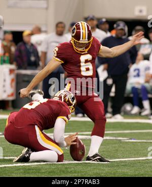 Washington Redskins placekicker Graham Gano (4) boots a 48-yard field goal  in overtime as Hunter Smith (17) holds to give the Redskins a 19-16 win  over the Tennessee Titans in an NFL