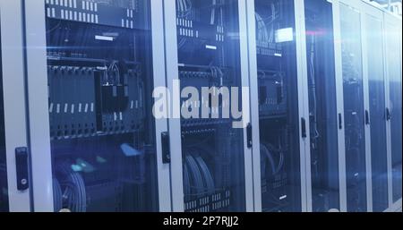 Composition of glowing light and data processing over computer servers Stock Photo