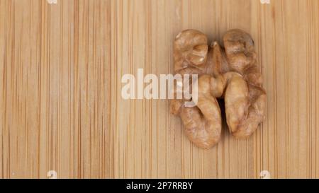 Walnuts on a wooden background. Close-up. Selective focus. Stock Photo