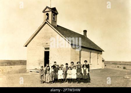 One Room Schoolhouse with Students and Teacher early 1900s, American West, One Room School House. Stock Photo