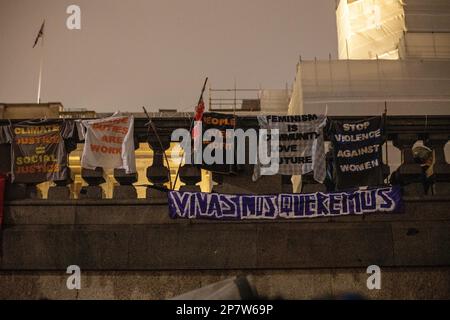 London, UK - 8 March 2023: On a cold and rainy evening, women from various backgrounds, including British, French, Iranian, Turkish, Chinese, Mexican, Afghan, and numerous other nationalities and groups, joined together in Trafalgar Square to mark International Women's Day. Credit: Sinai Noor / Alamy Live News