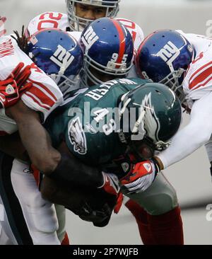 Philadelphia Eagles' Leonard Weaver (43) dives for a first down over  teammate Todd Herremans (79) and Washington Redskins' Cornelius Griffin  (96) in the first half of an NFL football game, Sunday, Nov.