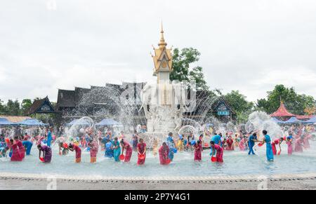 Members of the Dai minority ethnic group celebrate the new years purifying tradition of splashing water on each other at a water park in Yunnan China Stock Photo