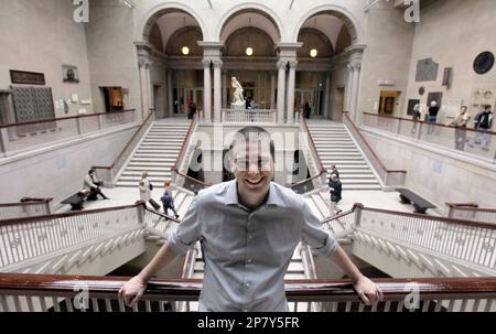 In this photo made Wednesday, Oct. 14, 2009, Andrew Mason of Groupon, a online startup for bargain hunters looking for group discounted sales, stands on the grand staircase of the Art Institute of Chicago, one of his company's clients, in Chicago. (AP Photo/M. Spencer Green)