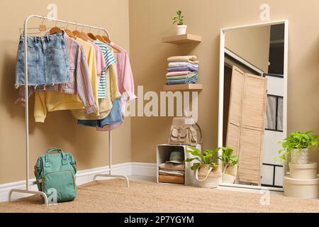 Stylish dressing room interior with trendy clothes Stock Photo