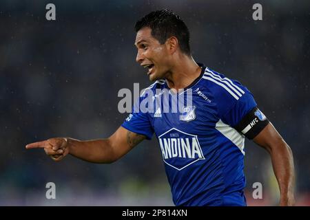 David Silva of Colombia's Millonarios, left, heads to score his side's  opening goal against Brazil's Atletico Mineiro during a Copa Libertadores  soccer match at El Campin stadium in Bogota, Colombia, Wednesday, March