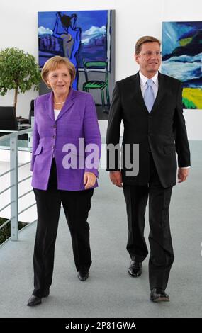 Angela Merkel, German Chancellor and leader of the conservative Christian Democratic Union party (CDU), left, and Guido Westerwelle, leader of the pro-business Free Democrats (FDP) meet at the Chancellery in Berlin Monday September 28, 2009. Merkel's conservatives vowed on Monday to seal a coalition deal with the Free Democrats (FDP) within a month after winning Germany's election. (AP Photo/Wolfgang Rattay,Pool)
