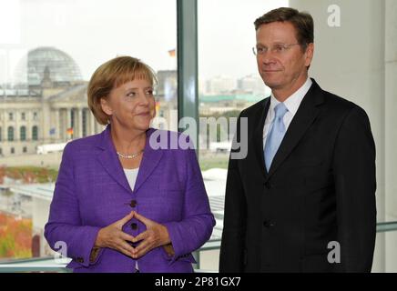 Angela Merkel, German Chancellor and leader of the conservative Christian Democratic Union party (CDU), left, and Guido Westerwelle, leader of the pro-business Free Democrats (FDP) meet at the Chancellery in Berlin Monday Sept. 28, 2009. Merkel's conservatives vowed on Monday to seal a coalition deal with the Free Democrats (FDP) within a month after winning Germany's election (Bundestagswahl). (AP Photo/Wolfgang Rattay,Pool)