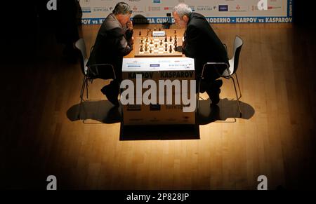 Former chess world champions Garry Kasparov, right, and Anatoly Karpov,  left, play an exhibition rematch in Valencia, Spain, Tuesday, Sept. 22,  2009. Chess eminences Kasparov and Karpov are dusting off their knights