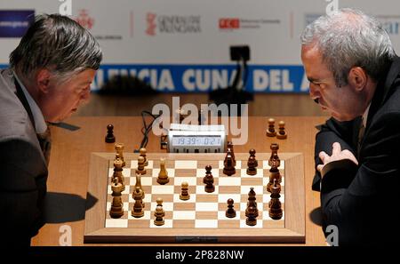 Former chess world champions Garry Kasparov, right, and Anatoly Karpov,  left, play an exhibition rematch in Valencia, Spain, Tuesday, Sept. 22,  2009. Chess eminences Kasparov and Karpov are dusting off their knights